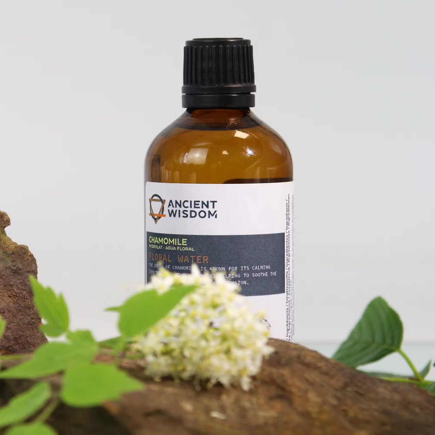 Bottle of 'Ancient Wisdom' chamomile oil with a natural background