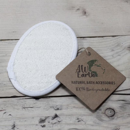 White reusable makeup pad with a 'All Earth' tag on a wooden surface