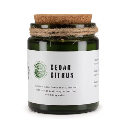 Candle jar labeled 'Cedar Citrus' with a cork lid and twine, on a white background.