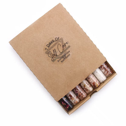 Box of 7 Days of Self Care bath salts with a brown kraft paper cover.