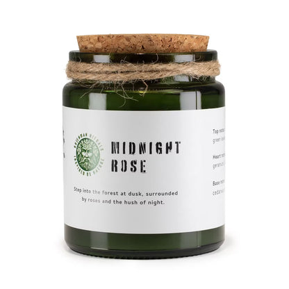Candle in a glass jar with a cork lid and white label on a white background