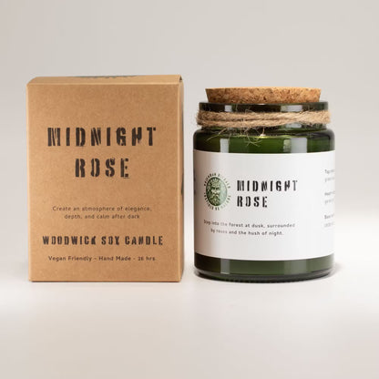 Woodwick soy candle labeled 'Midnight Rose' with its packaging on a light gray background