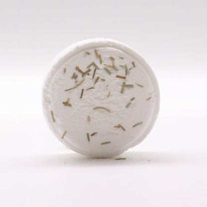 Round white object with specks on a white background