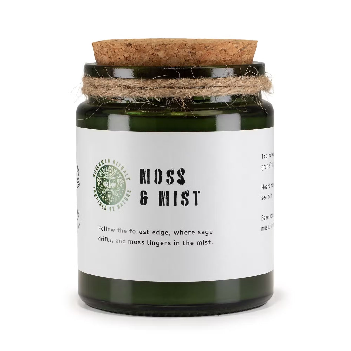 Candle jar labeled 'Moss & Mist' with a cork lid on a white background