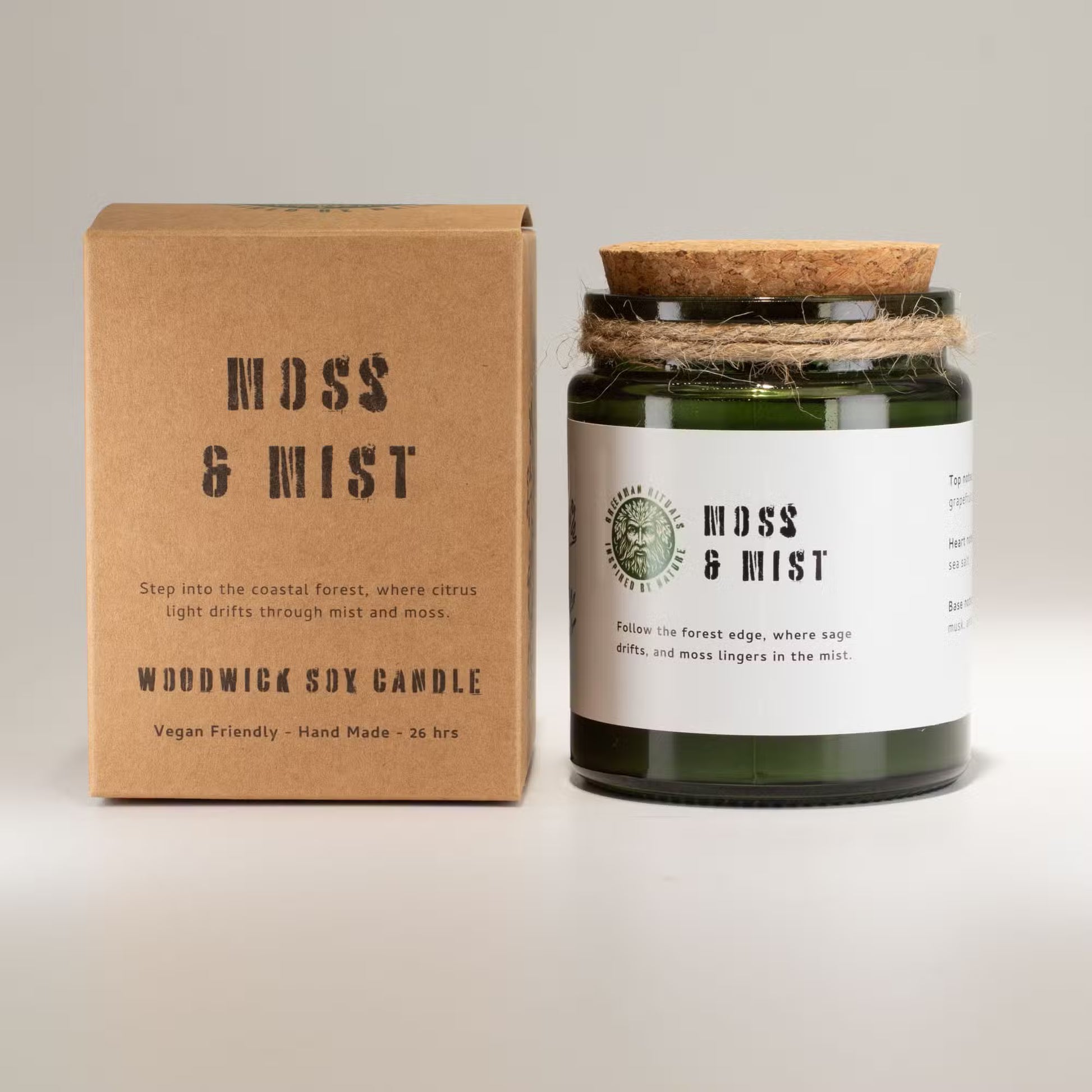 Moss & Mist candle with packaging on a light gray background