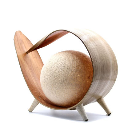 Wooden sculpture with curved design on a white background
