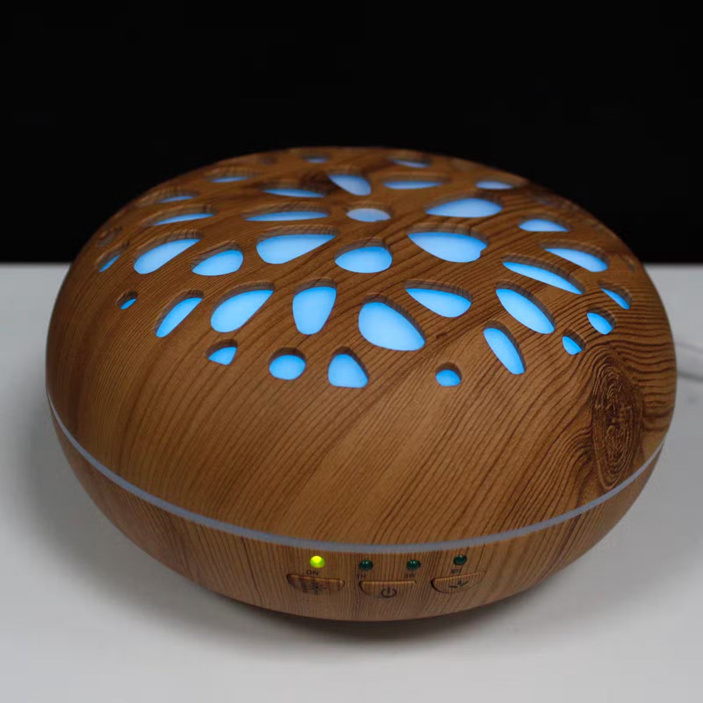 Wooden diffuser with blue lights on a white surface