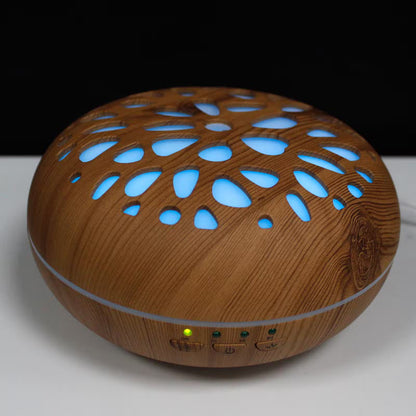 Wooden diffuser with blue lights on a white surface