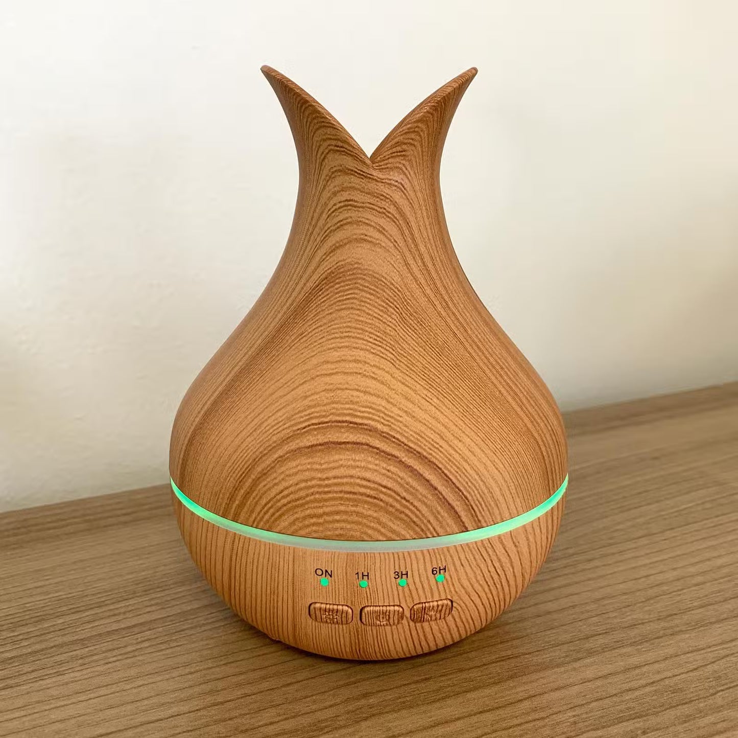 Wooden-textured diffuser on a wooden surface with a plain background