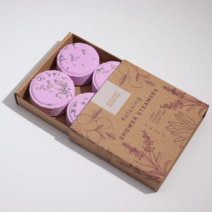 Box of pink shower steamers with a brown cardboard box on a white background