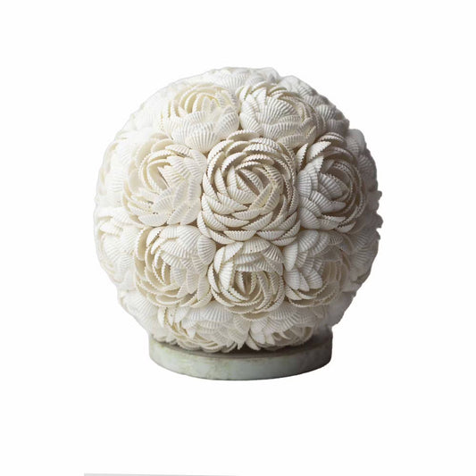 Decorative sphere made of seashells on a white background