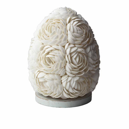 Decorative object made of white seashells on a white background