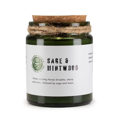 Candle jar labeled 'Sage & Mintwood' with a cork lid on a white background