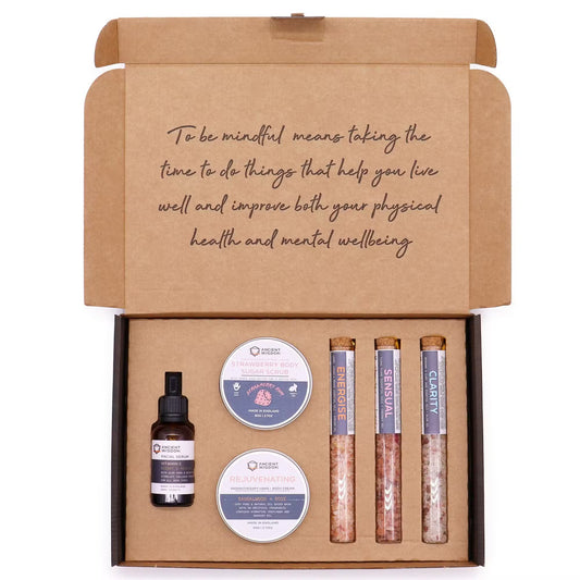 Health and wellness product set in a brown cardboard box with text on a white background