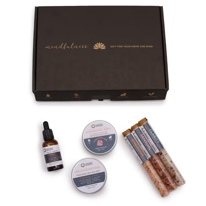 Set of wellness products including a bottle, two containers, and three sticks on a white background with a 'mindfulness' branded box.