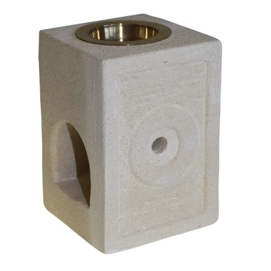 Square concrete block with a circular hole and metallic interior on a white background