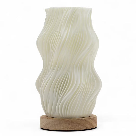 An off-white ceramic vase with a wavy, pleated texture, displayed on a round natural wood base against a clean white background.