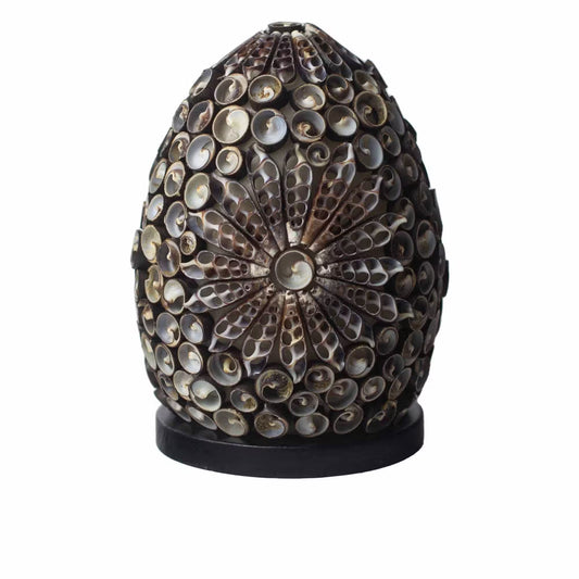 Decorative egg-shaped object with shell碎片 on a white background