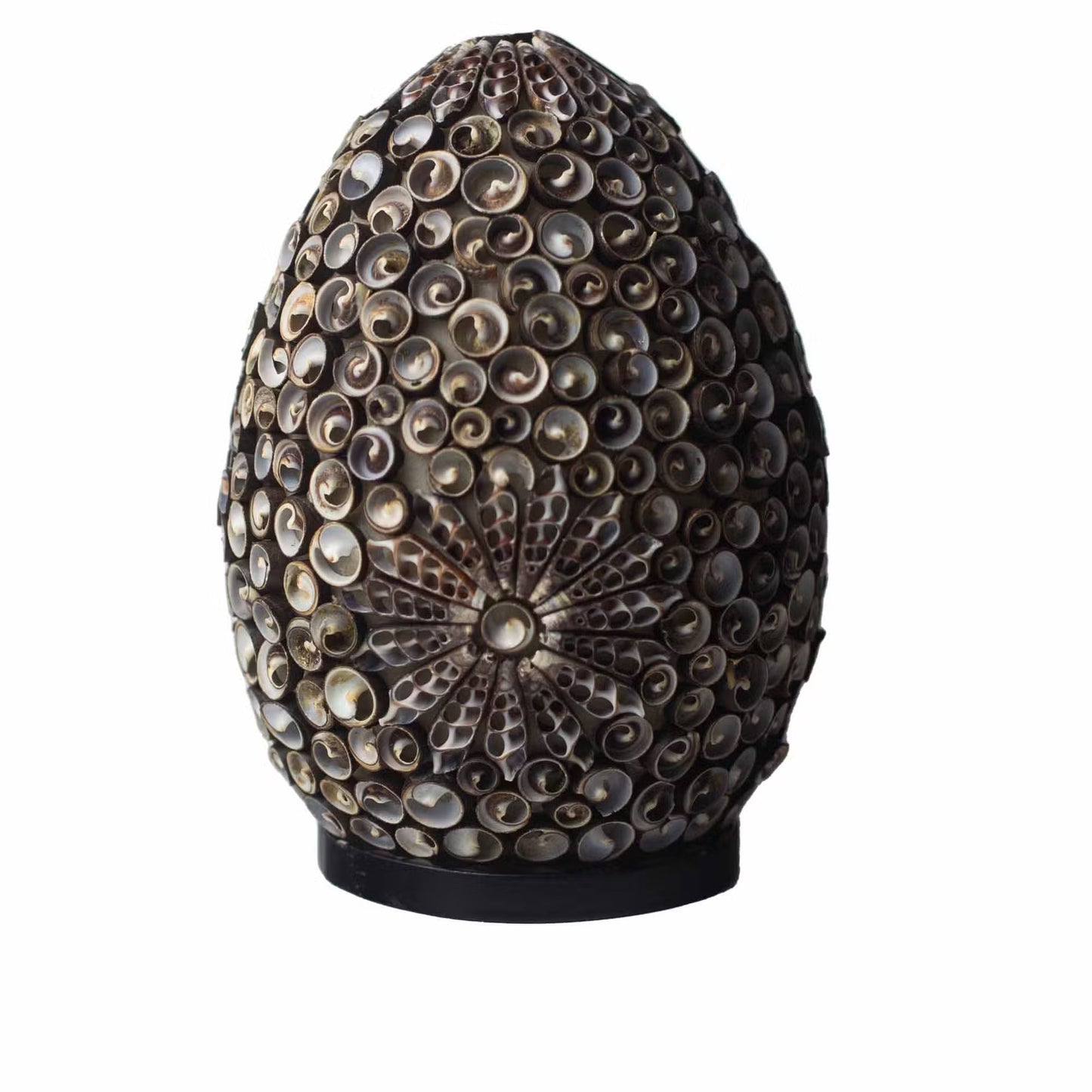 Decorative object with shell-like patterns on a white background