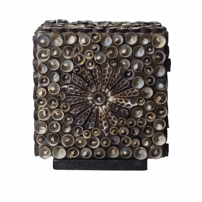 A square decorative metal box or cabinet with a dark bronze finish, featuring a central sunburst pattern and rows of circular metallic accents on the front, shown against a plain white background.