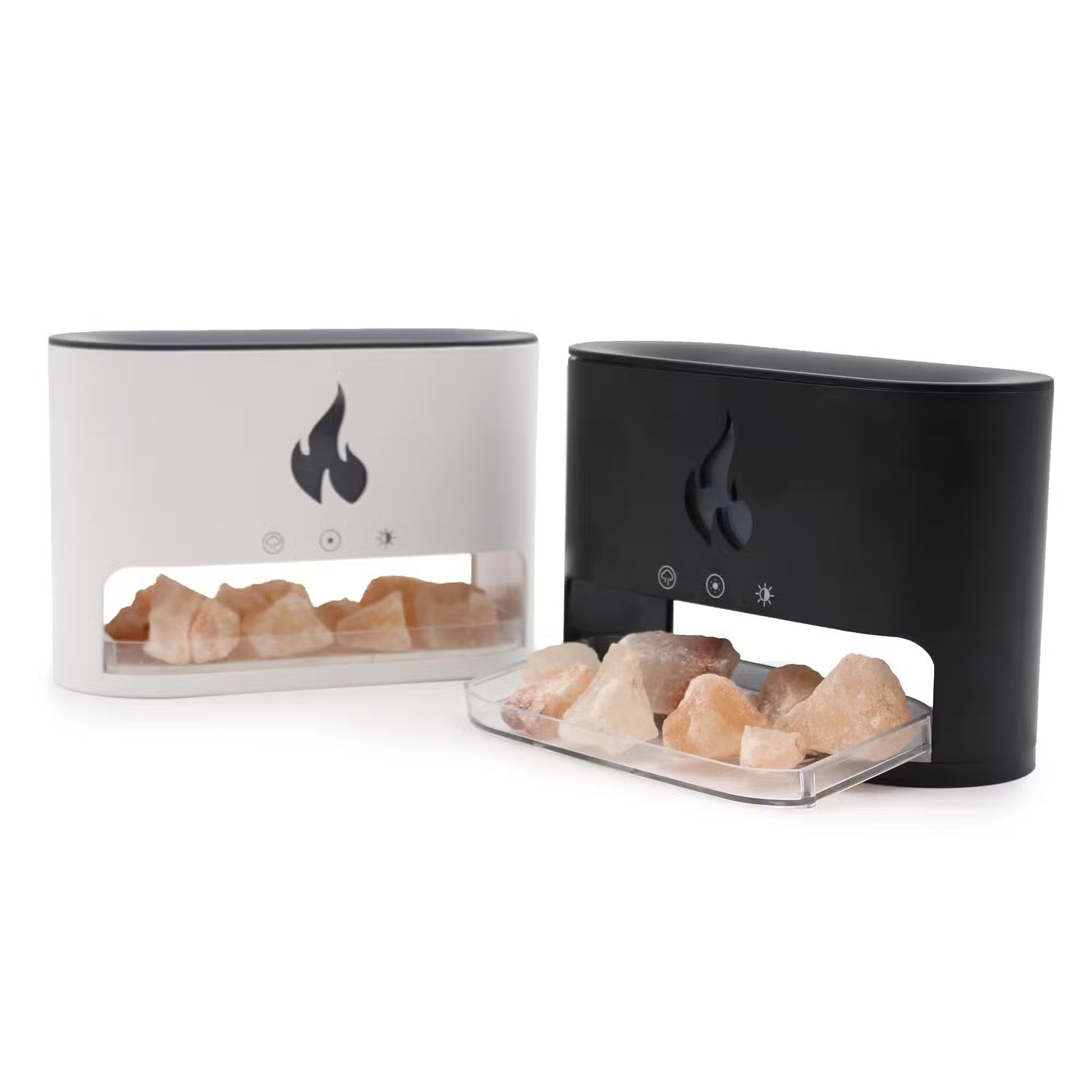 Two Himalayan salt lamps with rock salt on a white background