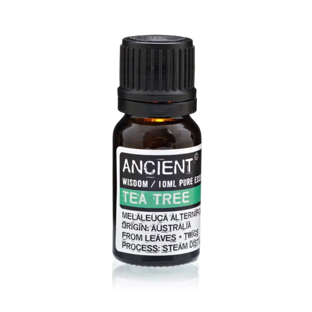 A 10ml amber glass bottle of Ancient Wisdom Tea Tree essential oil with a black ribbed cap and a black, white, and green label.