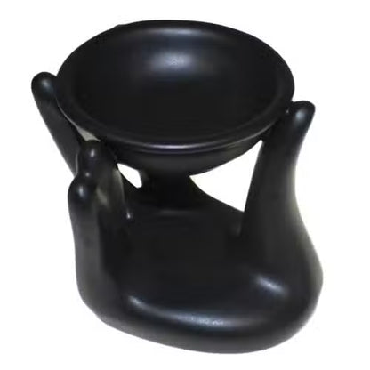 Black ceramic oil burner on a white background