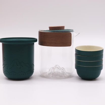 Set of green ceramic and glass kitchenware items on a white background