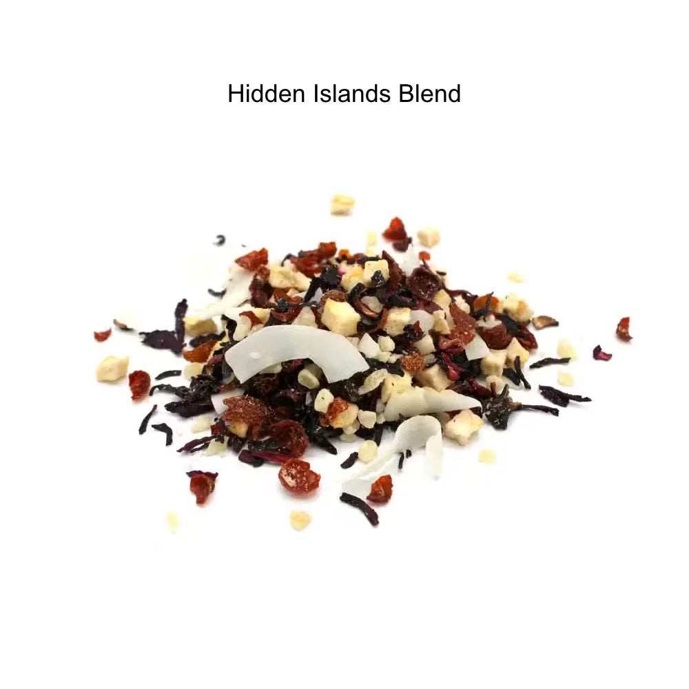 A small pile of loose-leaf tea labeled 'Hidden Islands Blend' on a plain white background. The blend contains dark tea leaves, dried red fruit pieces, white coconut flakes, and small beige nut pieces.