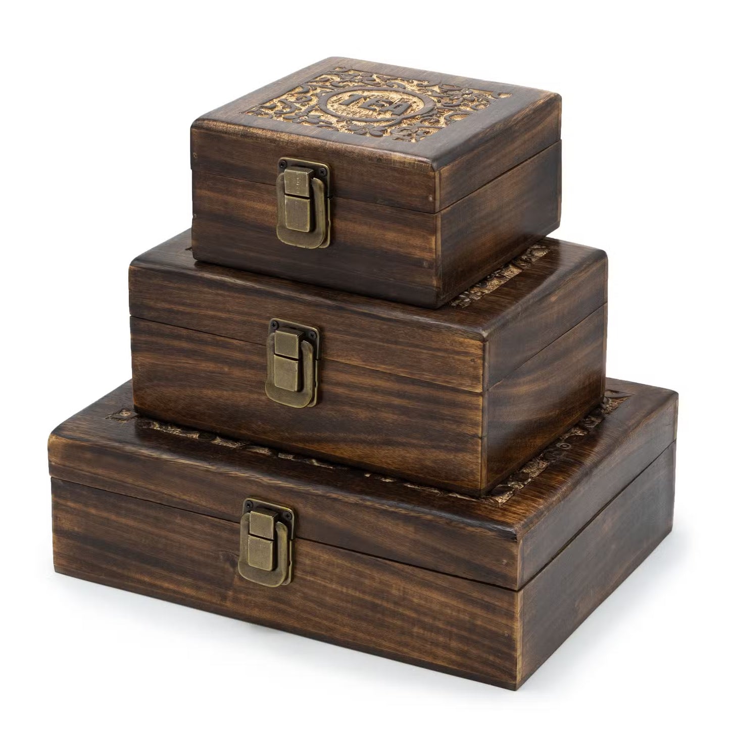 Set of three wooden boxes with decorative lids on a white background